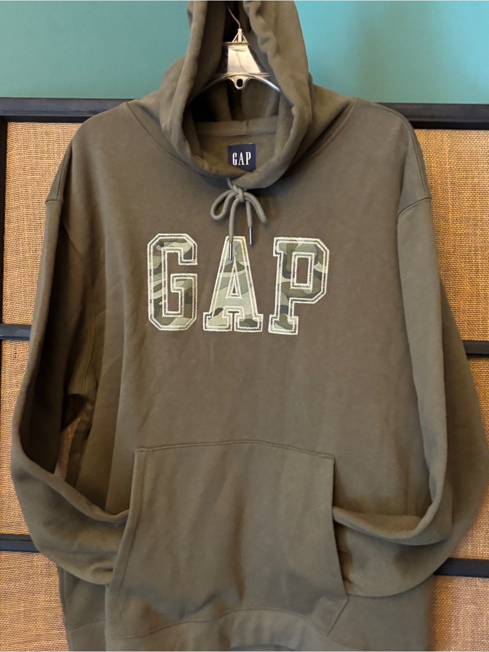 GAP camo green pullover hoodie. Lettering is camo print size XL drawstring hood